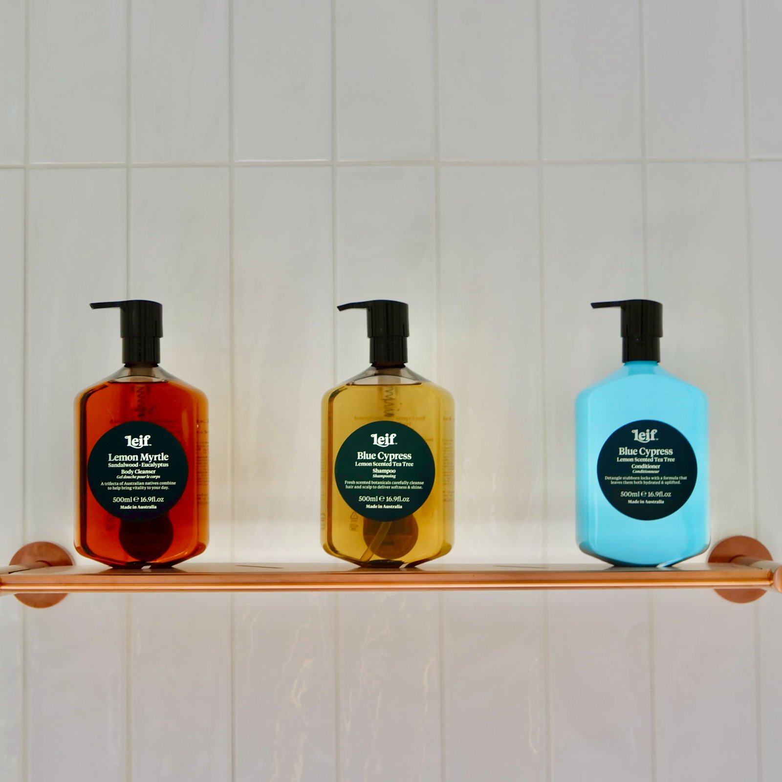 Different shampoo bottles arranged on a shelf, representing formulas for different hair types