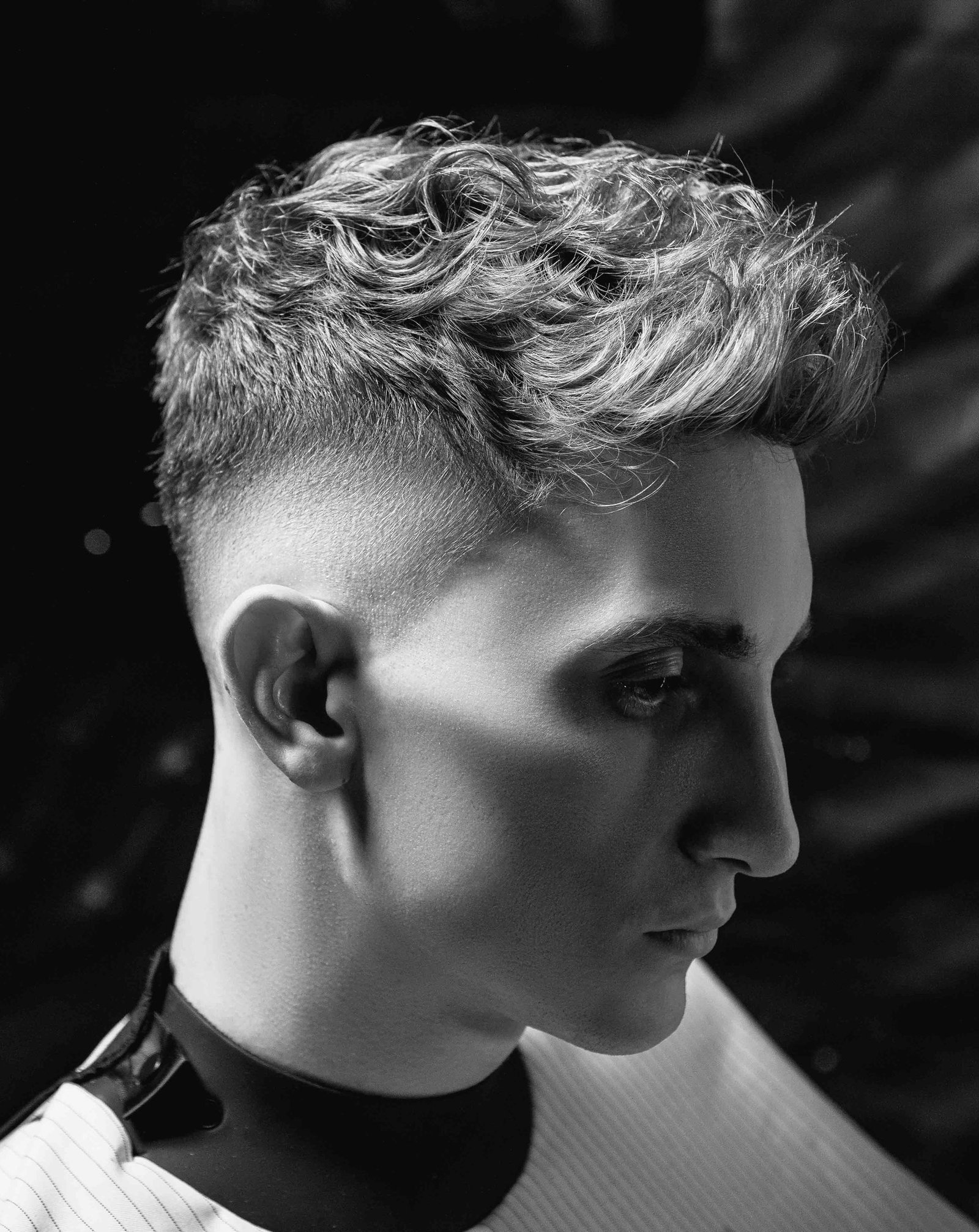 Man with textured medium length hair styled with a quiff