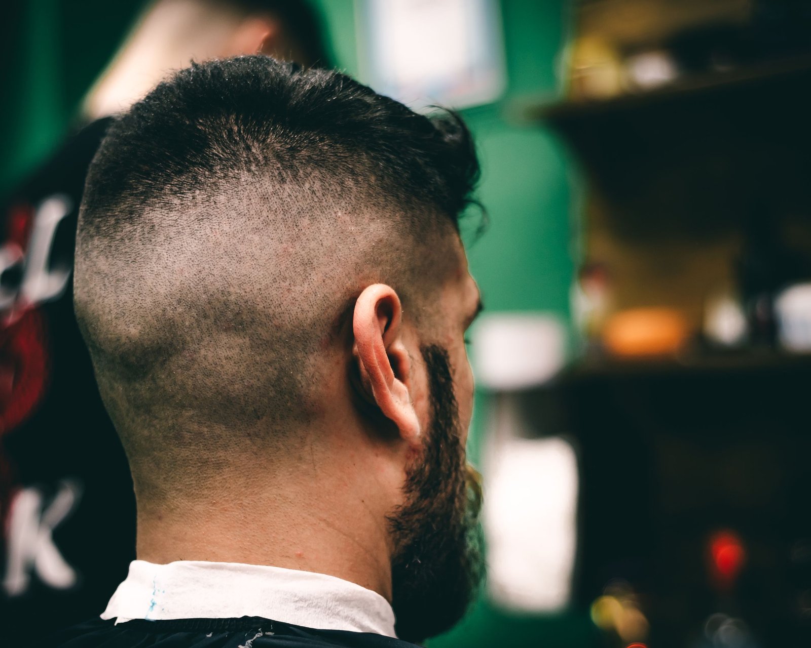 Rear view of a high and tight haircut with a sharp fade transition on the sides