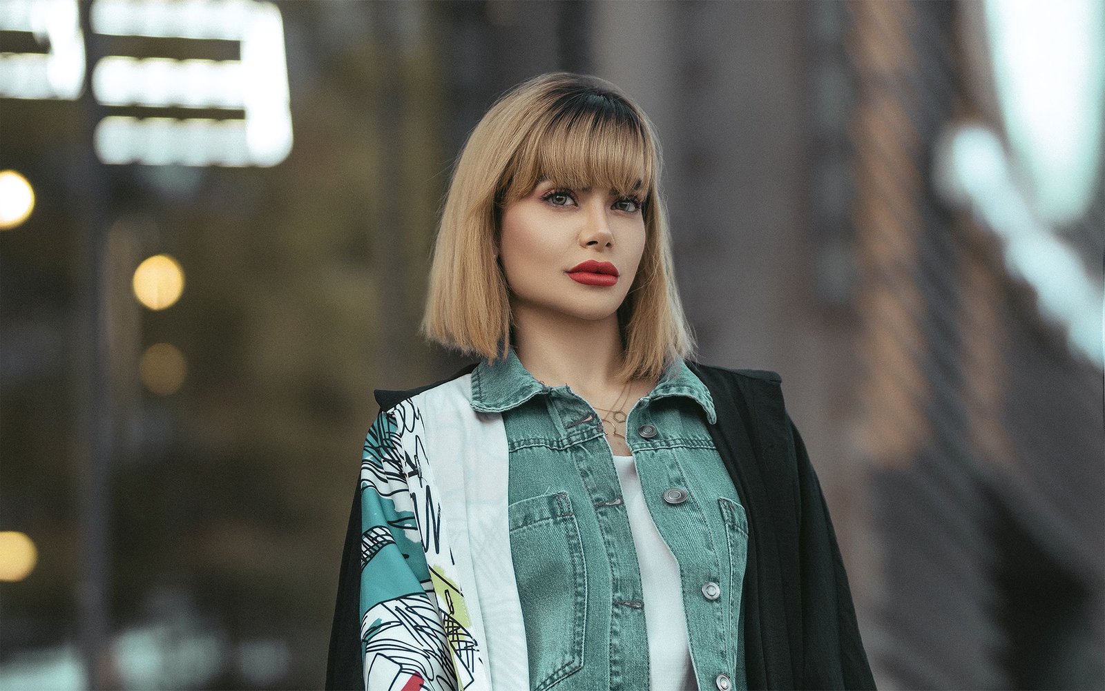 Woman wearing soft curtain bangs that frame the face