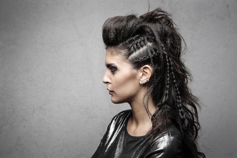 Woman with a mohawk braid hairstyle shown in profile