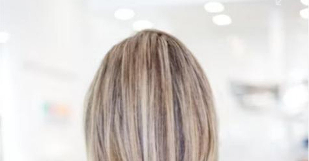 Cool ash blonde balayage hair with smoky, neutralized undertones