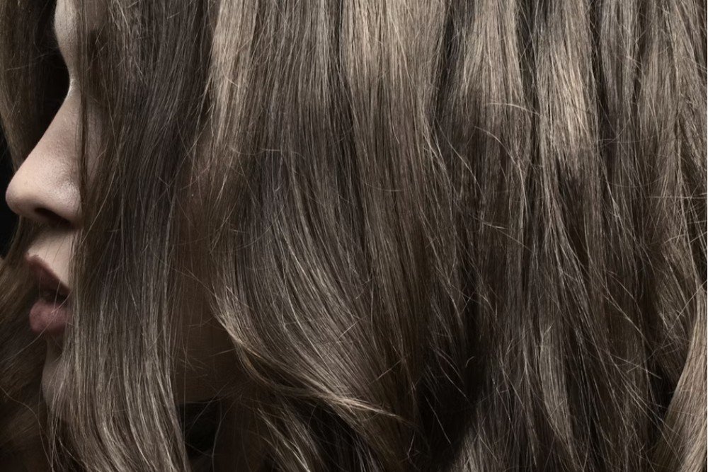 Close-up of multi-dimensional ash brown hair texture