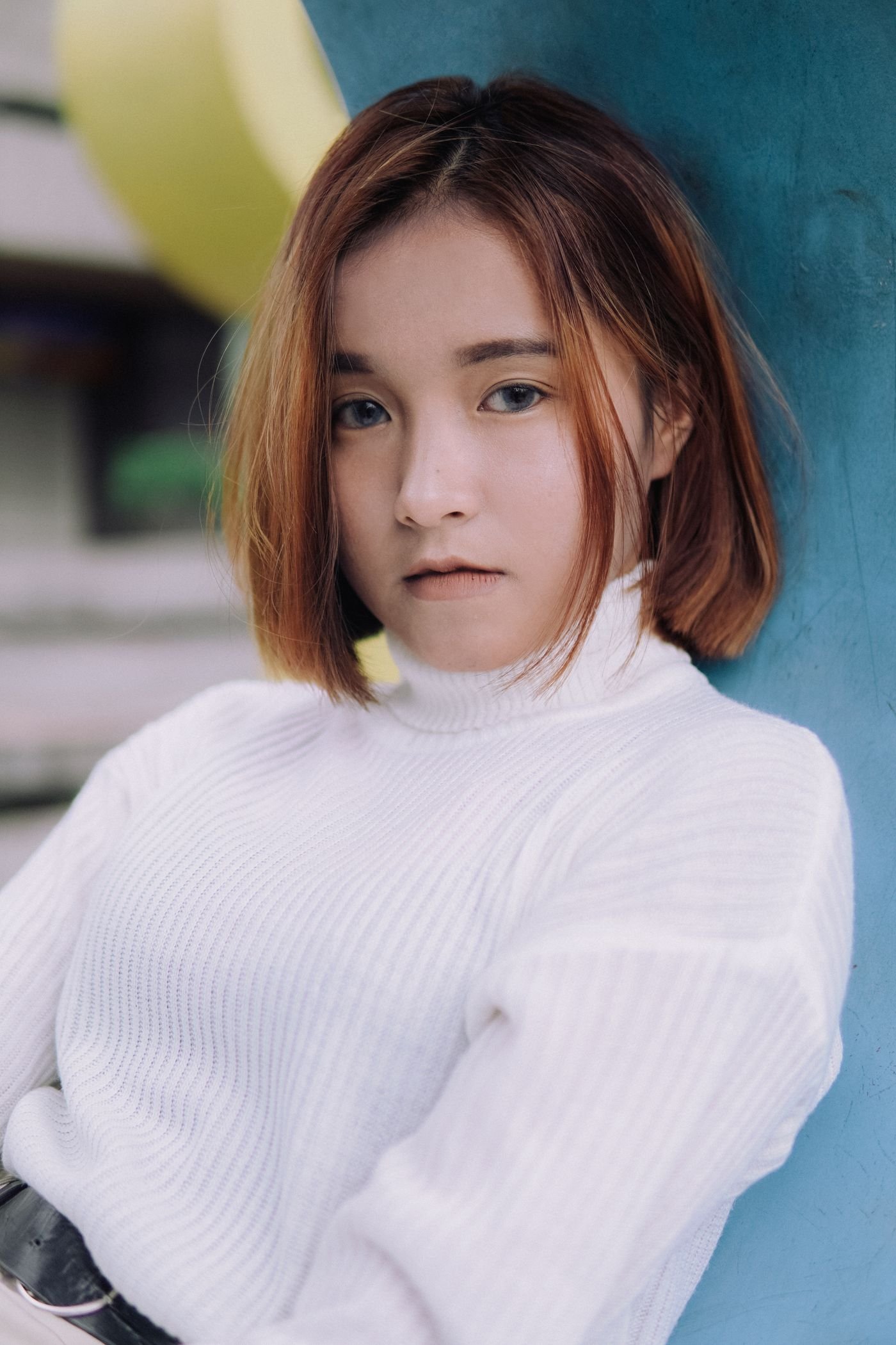 Stylish portrait of a young woman with a short bob haircut