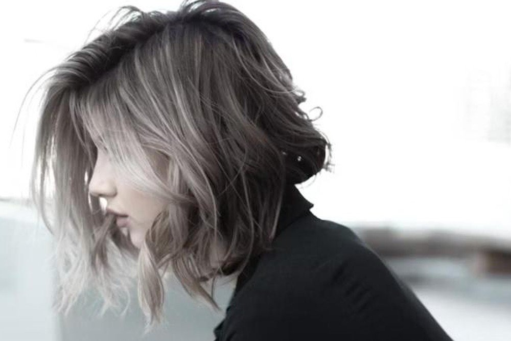 Close-up of layered gray hair with dimensional silver and ash tones
