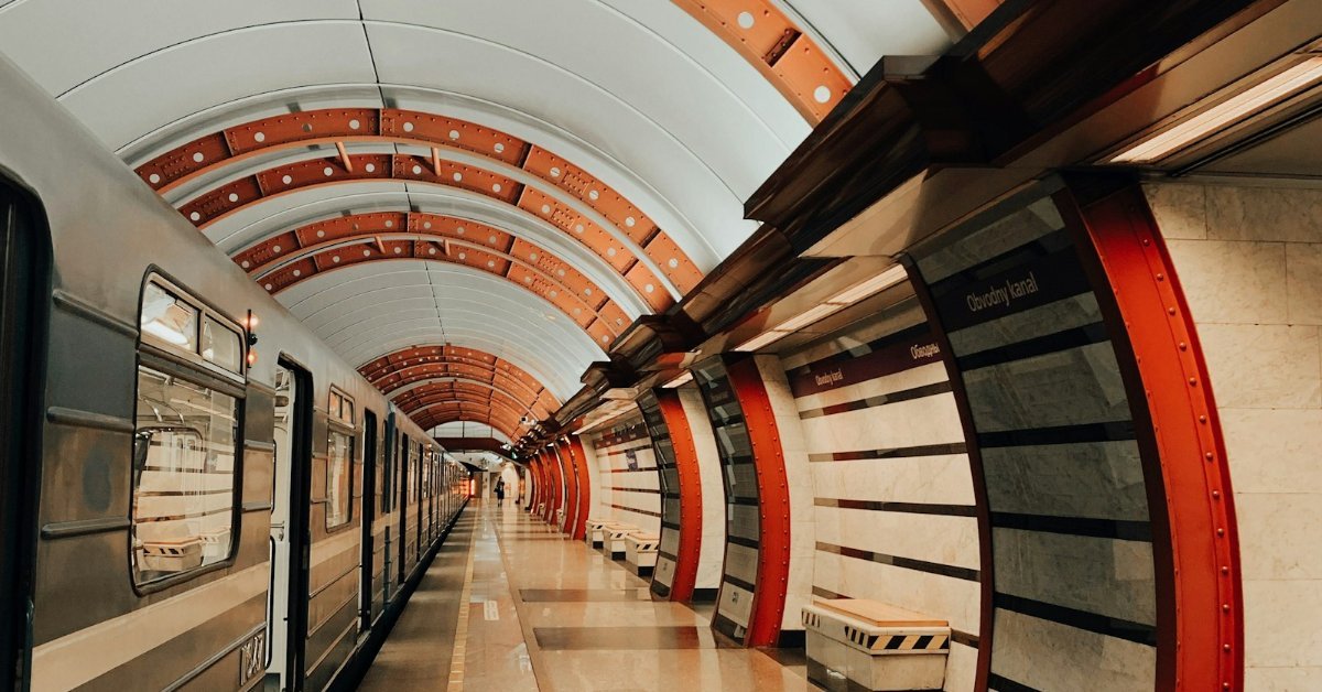 Modern metro station hallway with escalators