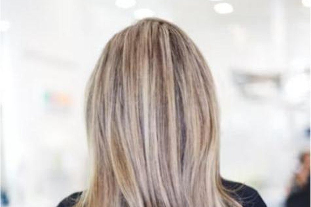 Close-up of long hair styled with a smooth ombre color transition