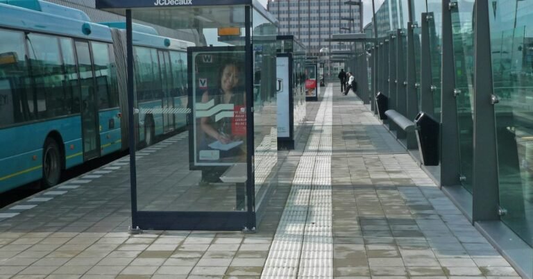 Public bus parked at a bus terminal stop