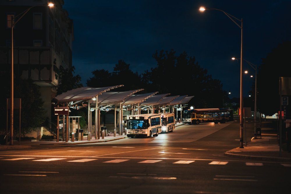 Public bus waiting at a terminal stop in the UAE