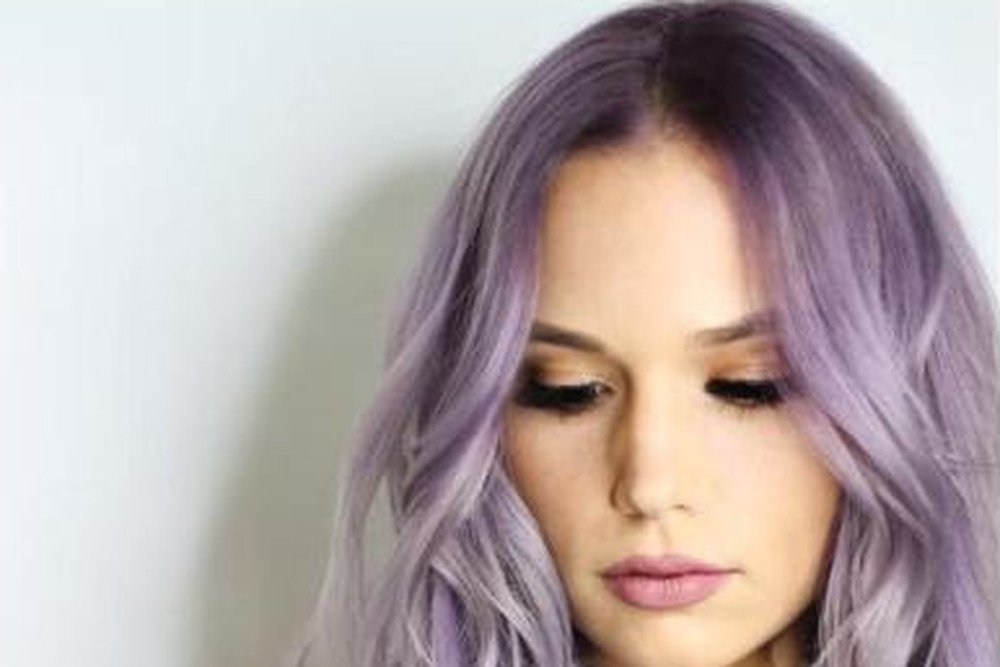Close-up of pastel lilac purple hair color from the crown to the ends
