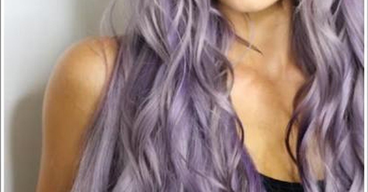 Long wavy silver purple hair showing icy silver and violet tones blended together